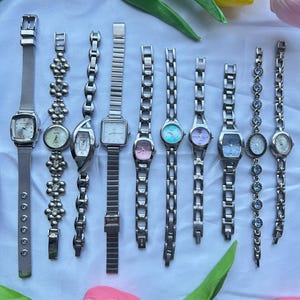 10 silver toned watches, sold separately