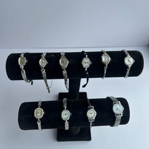 10 Silver toned watches, sold separately