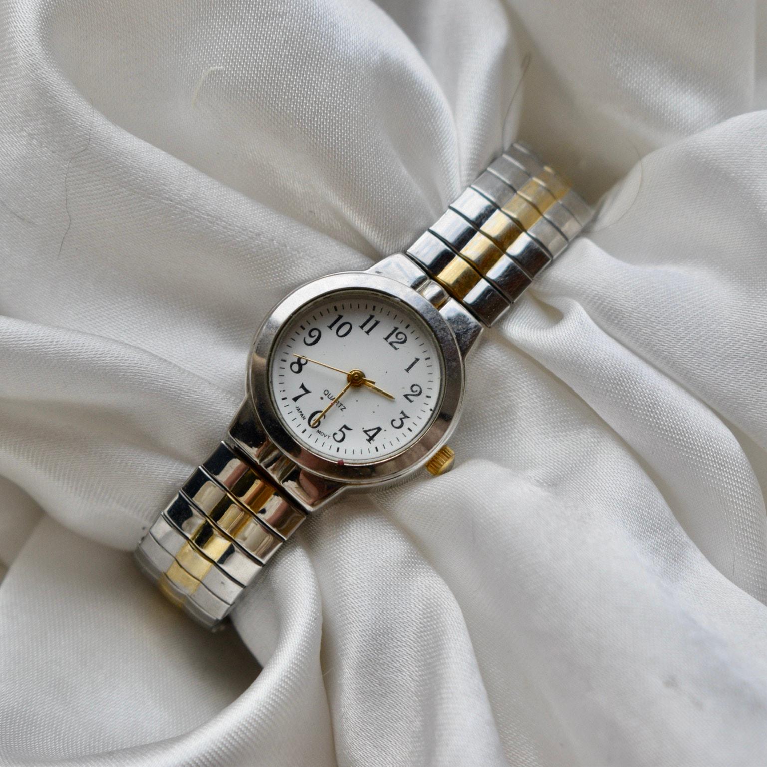 Montre pour femme de style bracelet extensible bicolore en or et