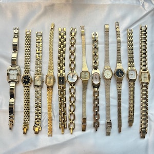 12 gold toned watches, sold separately