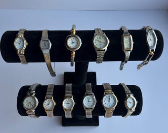 12 gold and silver two toned/mixed metal watches, sold separately