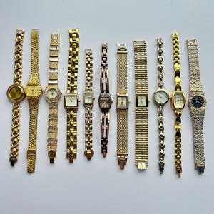11 gold toned watches, sold separately