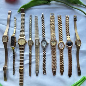 10 gold toned watches, sold separately