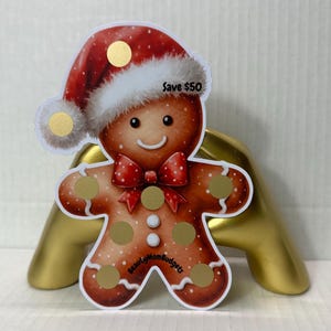 Sfida di risparmio con gratta e vinci di pan di zenzero di Babbo Natale / Risparmia 50 / Cappello di Babbo Natale