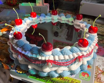 baby blue and red coquette 3d cake mirror