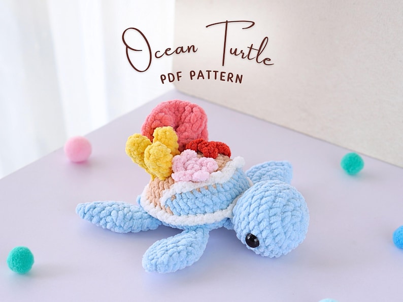 May include: A crocheted ocean turtle toy with a blue body and a shell decorated with colorful coral. The toy is made with soft yarn and has a sweet expression.