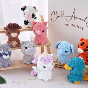May include: A collection of ten crocheted animal plushies, including a cow, horse, pig, raccoon, hippopotamus, elephant, tiger, unicorn, platypus, and a duck. The plushies are arranged on a wooden shelf with the text "Chill Animal Crew PDF Pattern" on a white background.
