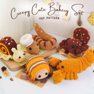 May include: A selection of crocheted bakery items, such as a snail, worm, bunny, spider, donut, and croissant. The items are in brown, orange, and white, with the text "Creepy Cute Bakery Set PDF Pattern" displayed at the top.