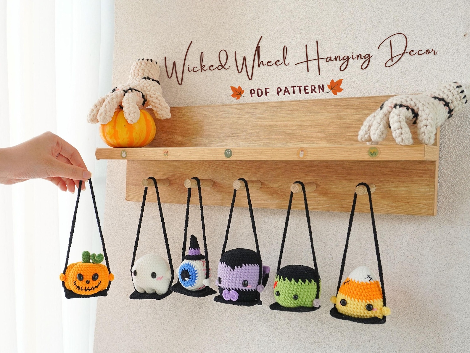 Crochet Halloween hanging ornaments including pumpkin, ghost, Frankenstein, vampire, and candy corn