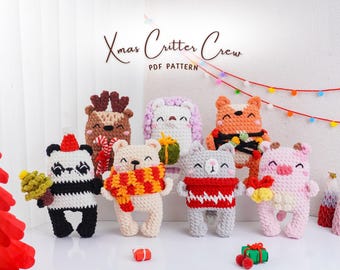 May include: A collection of handmade crochet Christmas critters, including a panda, bear, cat, fox, pig, reindeer, and bunny. Each critter is uniquely designed with festive accessories and colors. The text "Xmas Critter Crew PDF Pattern" is displayed above the critters.