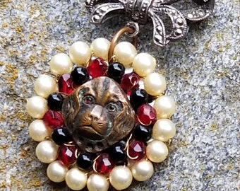 Vintage assemblage necklace   Spaniel with red stone eyes  marcasite bow  repurposed button  onyx  pearl   red crystal