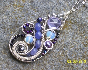 Silver lavender purple swirl medallion necklace with corundum, opaline, lucite crystals