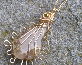 Rutilated quartz   golden inclusions  gold wire wrapped