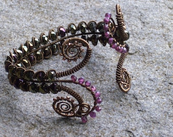 Bronze Wire work Bracelet    wire weaving with garnets and iridescent bronze beads