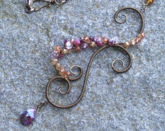 Bronze swirl necklace with  rainbow mystic hessonite garnet, pink mystic topaz, ruby, garnet, apricot quartz