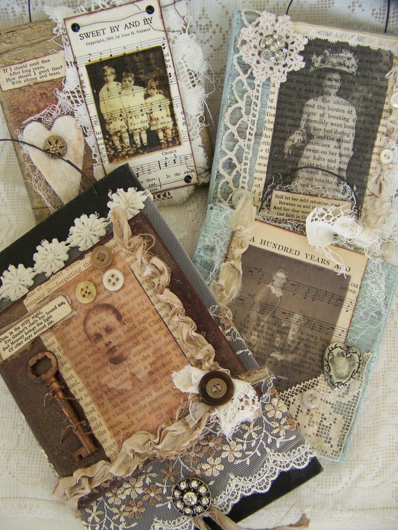 May include: Four small, square, wooden boxes decorated with vintage paper, lace, and fabric scraps. Each box features a different image and text, including a group of children, a woman in a dress, a key, and a man's face. The boxes are perfect for storing small treasures or trinkets.