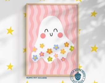 May include: A framed print featuring a smiling white ghost decorated with colorful flowers. The background has pink vertical stripes. The text "MORE COLOUR OPTIONS AVAILABLE" is at the top. The print is from "LITTLE ACORN PRINTS EST. 2025".