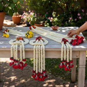 Marigold mogra leaf garland strings displayed as Indian home decor — reusable artificial floral garland for wedding and housewarming