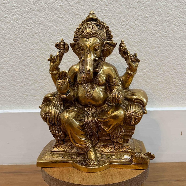Front view 9.5" Brass Ganpati idol with elephant head and antique gold finish on white background