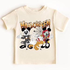 A white t-shirt with a Halloween-themed graphic design featuring characters from the Disney movie " jack Skellington and Minnie Mouse".