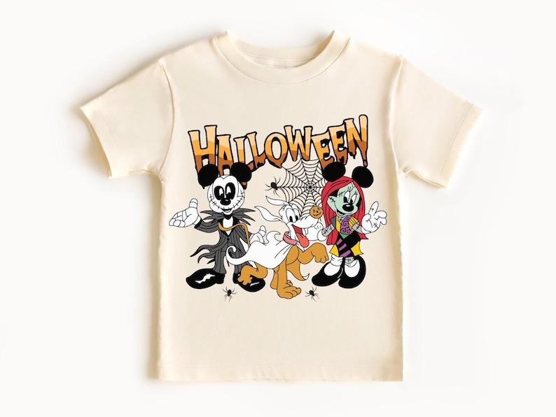 A white t-shirt with a Halloween-themed graphic design featuring characters from the Disney movie " jack Skellington and Minnie Mouse".