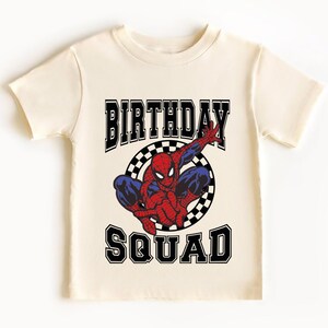 A white t-shirt with a graphic design featuring a Spider-Man character and the text "BIRTHDAY SQUAD" printed on it.