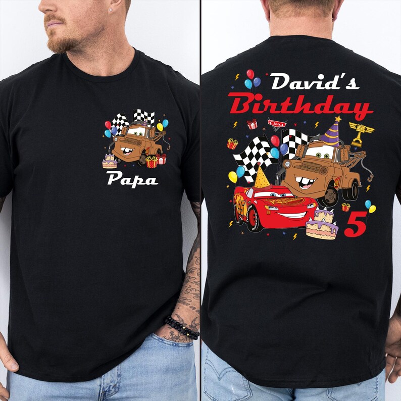 A black t-shirt with a personalized design featuring a cartoon character and birthday-themed elements.