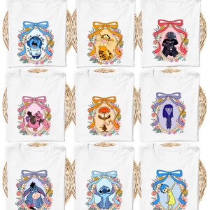 a collection of nine white t-shirts, each featuring a different cartoon character from popular children's television shows and movies. The characters are arranged in a 3x3 grid, with each row containing one character and each column containing one character. The characters are depicted in a variety of colors and styles, creating a visually appealing and diverse collection of t-shirt designs.
