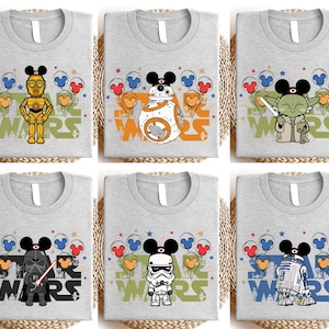 six t-shirts with various Star Wars characters and designs, including a robot, a character with a sword, and a character with a microphone.