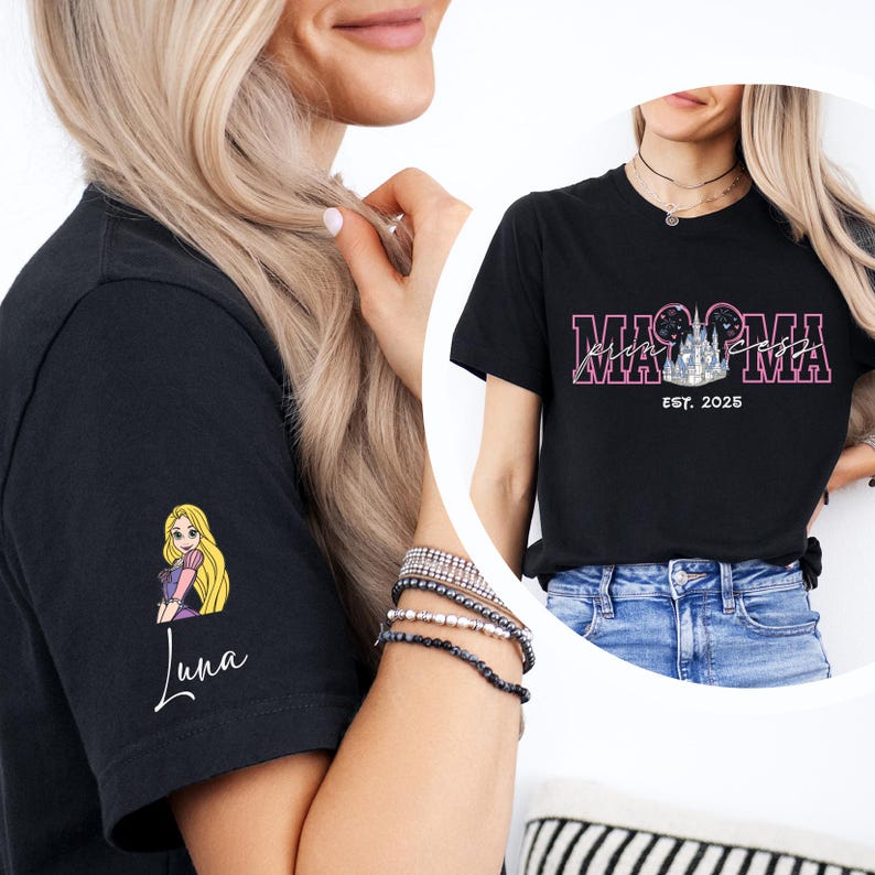a woman wearing a black t-shirt with a cartoon character on the sleeve, and another woman wearing a black t-shirt with the text "MAMMA" and "EST. 2025" printed on it.