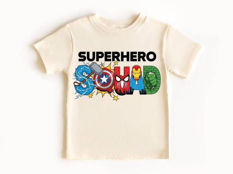 A white t-shirt with the text "SUPERHERO SQUAD" printed on it, featuring various superhero characters such as Captain America, Spider-Man, Iron Man, and Hulk.