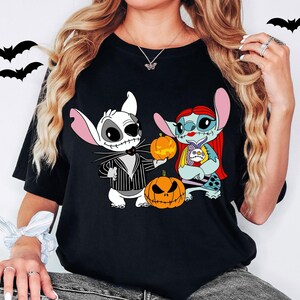 a woman wearing a black shirt with cartoon characters on it