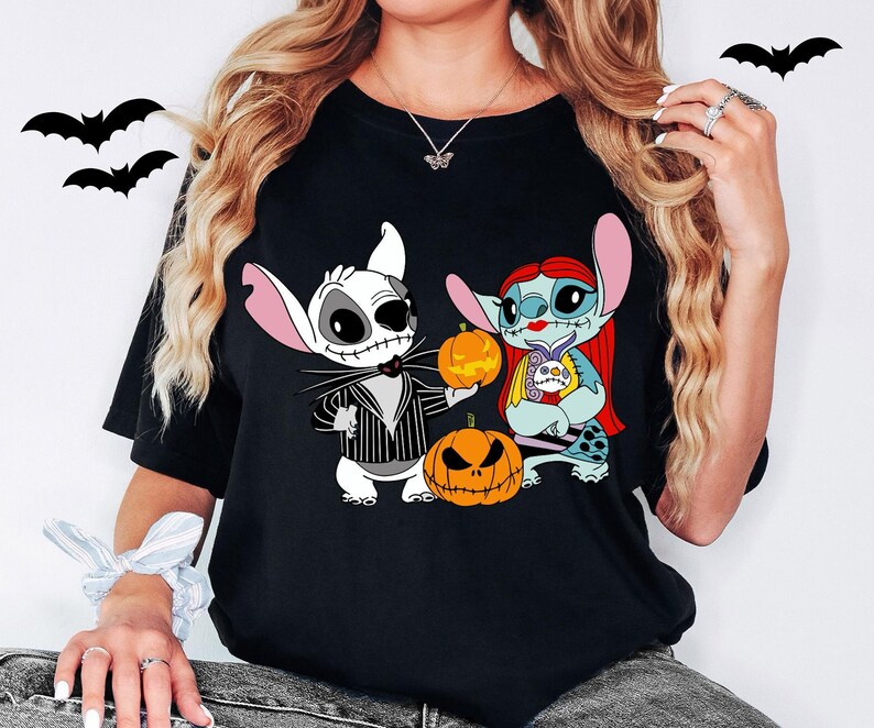 a woman wearing a black shirt with cartoon characters on it