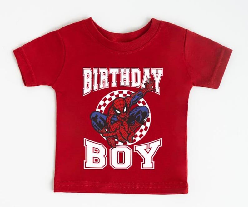 A red t-shirt with a Spider-Man graphic and the text "BIRTHDAY BOY" printed on it.