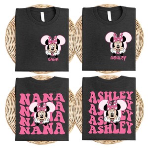 four identical black t-shirts with a Minnie Mouse design and the names "NANA" and "ASHLEY" printed on them.