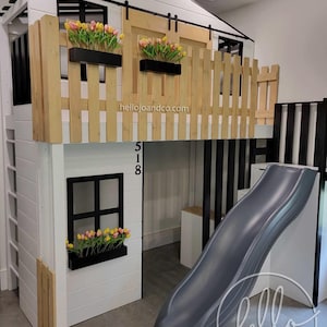 Custom Playhouse loft with drawer storage stairs, slide, barn doors and balcony