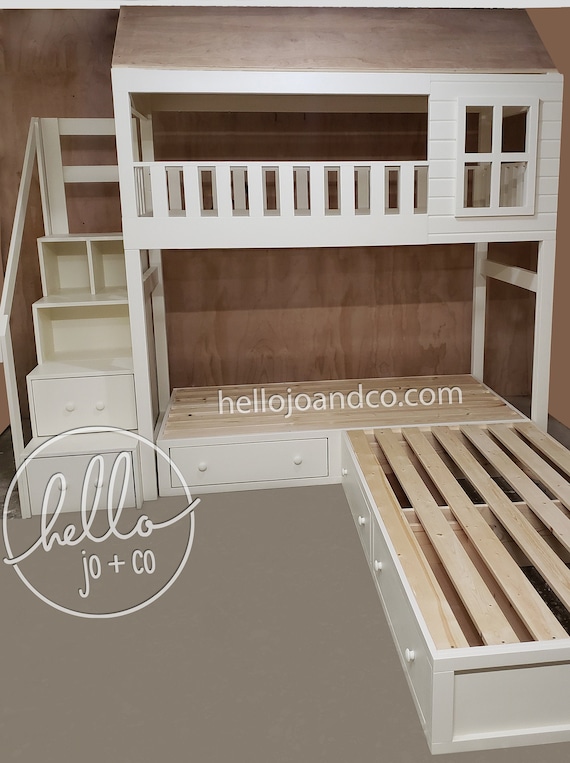 triple bunk beds with stairs and storage