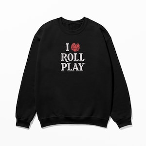 May include: Black sweatshirt with a white graphic that says "I ♥ ROLL PLAY" with a red heart-shaped dice.