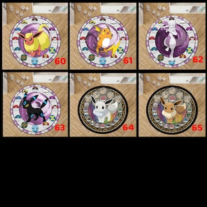 May include: A collection of six circular rugs featuring various animated creatures in the center, surrounded by a border of colorful spherical icons. Each rug is numbered from 60 to 65, displaying distinct characters like Flareon, Raichu, Mewtwo, Umbreon, Glaceon, and Eevee against vibrant, swirling backgrounds.