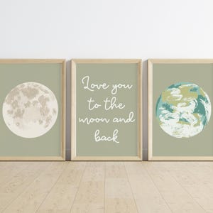 May include: Three framed art prints with a light green background. One print features a full moon, another has the text "Love you to the moon and back", and the third shows a depiction of Earth.