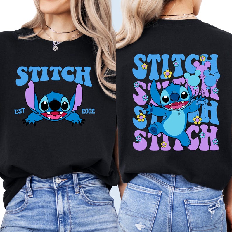 May include: Two black t-shirts with a blue Stitch character from Lilo & Stitch. One shirt has the text "Stitch" in a retro font with "EST 2002" below. The other shirt has the text "Stitch" repeated in a retro font with flowers and a blue Stitch character.