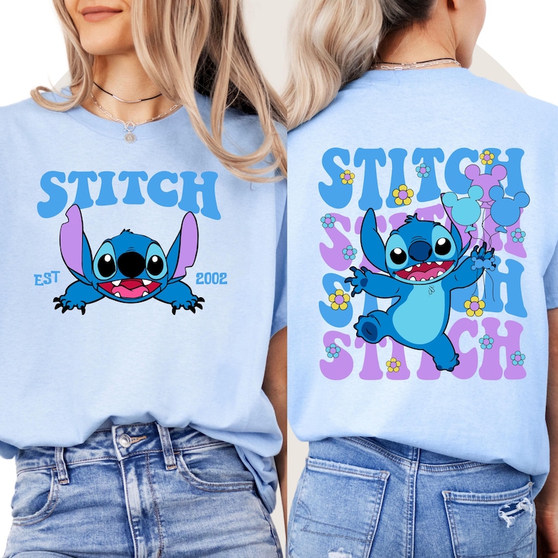 May include: Light blue t-shirt with a blue Stitch character holding balloons. The front of the shirt says "STITCH EST 2002" and the back of the shirt says "STITCH" in a retro font with flowers and balloons.