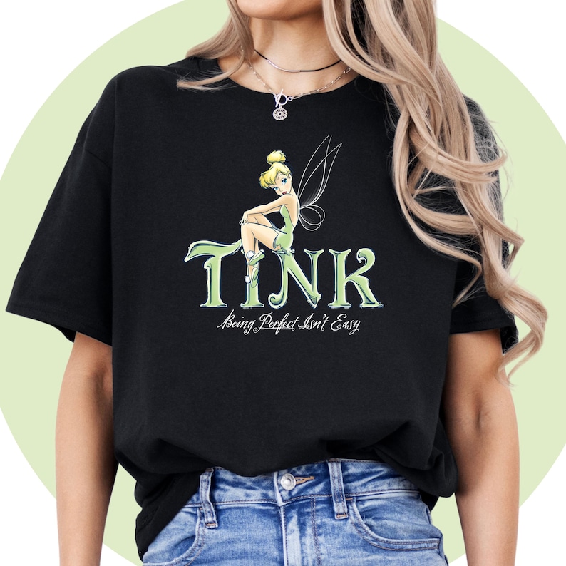 May include: Black t-shirt with a green Tinkerbell graphic and the text "TINK? Being Perfect Isn't Easy".