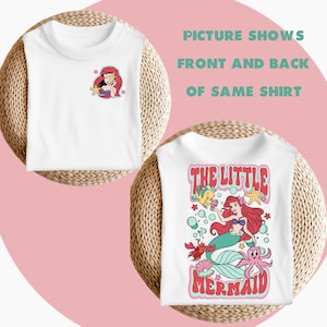 May include: White t-shirt featuring a cartoon image of Ariel, the Little Mermaid, on the front. The back of the shirt has a larger image of Ariel with the text "The Little Mermaid" in a retro font.