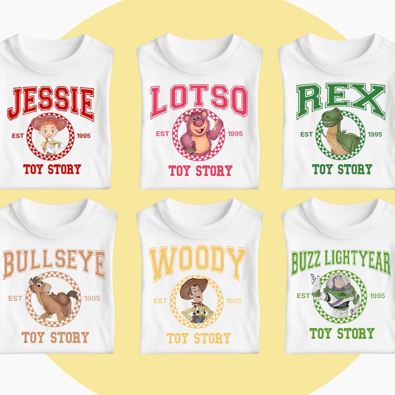 May include: White t-shirts featuring characters from the animated film Toy Story. Each shirt displays a character's name in a bold font, along with an image of the character, the text "EST 1995", and the words "TOY STORY".