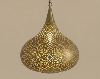 May include: A brass-colored pendant light fixture with an intricate, openwork design. The teardrop-shaped lamp hangs from a chain and features a detailed pattern that allows light to filter through, creating a warm, ambient glow. The fixture is suitable for indoor lighting.