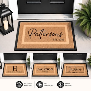 May include: A rectangular tan coir doormat with a black border, featuring customizable black text such as 'Pattersons EST. 2026', 'The Hill Family', or 'The Jackson Family'. The mat is weather-resistant, UV-protected, and snow-friendly.