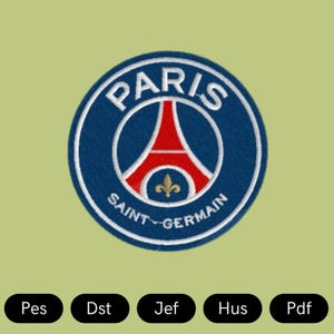 Peut inclure: Un patch circulaire bleu et blanc avec le texte "Paris Saint-Germain" et une tour Eiffel stylisée rouge et blanche.