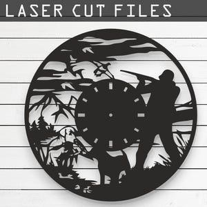 May include: Black and white laser cut design of a hunter with a gun and a dog in the woods. The design is in the shape of a clock face. The design is available in CDR, AI, SVG, DXF, and PDF formats.