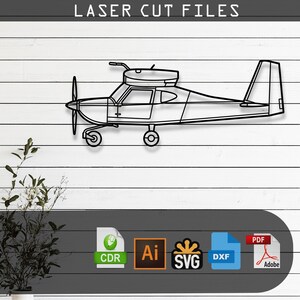 May include: A black line art silhouette of a single-engine airplane with a propeller and landing gear. The text LASER CUT FILES appears at the top. Below are icons for CDR, Ai, SVG, DXF, and PDF file formats for digital cutting machines.